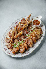 Lamb kebab on a decorative plate - Middle Eastern cuisine, barbecue, meat dishes, restaurant food, high resolution