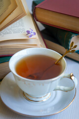 Cup of tea, bouquet of lilacs, spring still life.