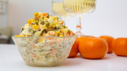 A large portion of New Year's salad is deliciously waiting on the plate