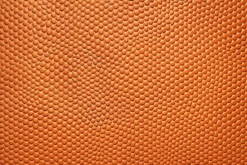Obraz premium Close-up detailed texture of vibrant orange surface with consistent repeating pattern and modern design elements, perfect for graphic design backgrounds and high-resolution macro photography