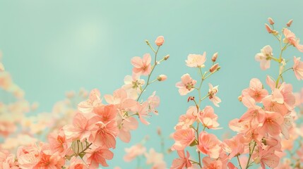 A row of trees with pink leaves are in front of a blue sky