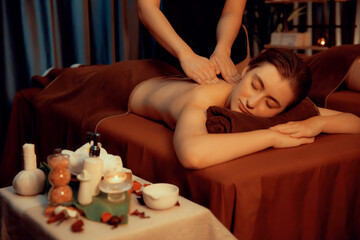 Caucasian couple customer enjoying relaxing anti-stress spa massage and pampering with beauty skin...