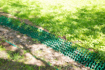 Obraz premium Strengthening of the soil from collapse.A special mesh for strengthening the soil.