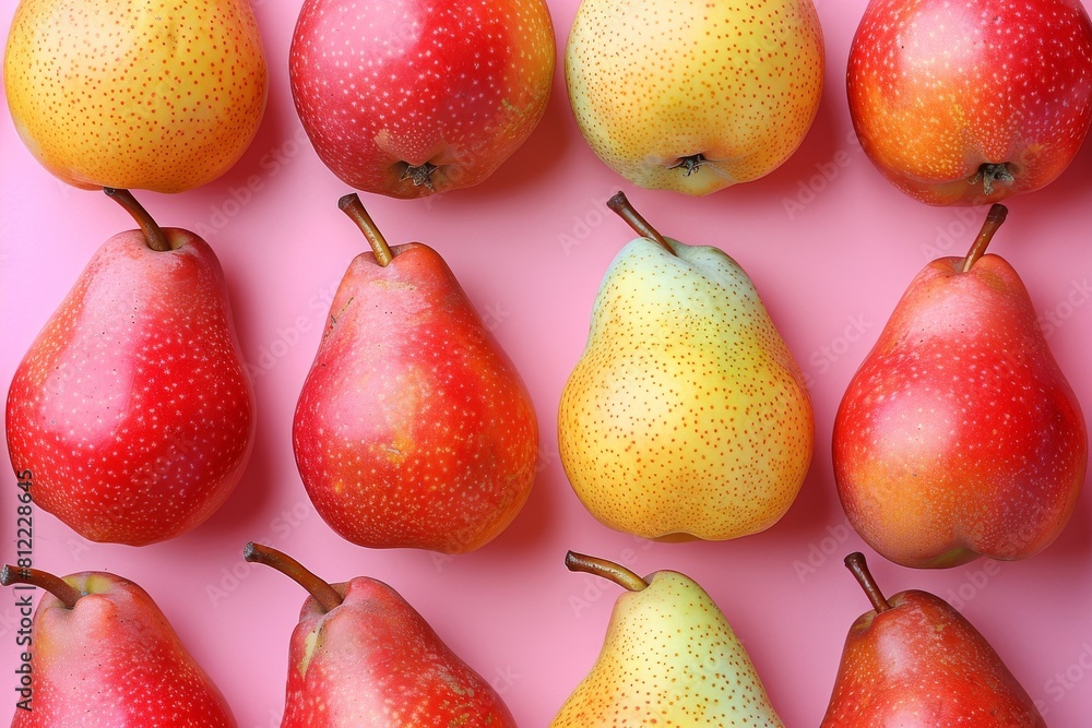 Aufkleber top view of a pattern of red and yellow apples aligned diagonally on a vibrant pink backdrop, creati