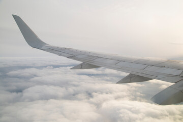 The wing of the aircraft, the view from the window of the aircraft.