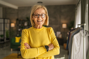 Portrait of one mature senior caucasian woman stand and smile at home