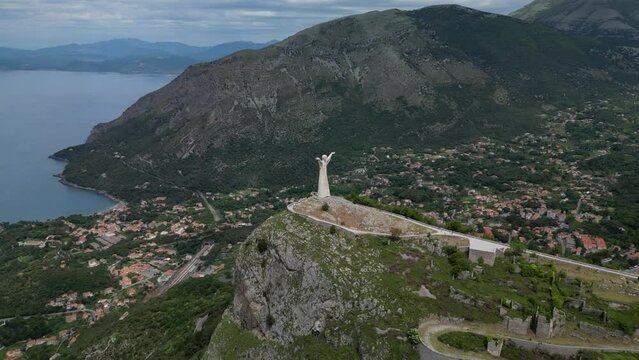 Aerial shot of Christ the Redeemer of Maratea overlooking the cliff,
Italy Basilicata
