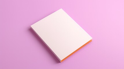 A white book with orange trim sits on a pink background