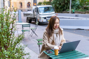 Asian businesswoman remote working on laptop computer for online corporate business economic...
