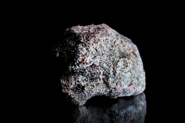 close up of a stone isolated on black background