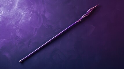 Naklejka premium Violet magical wand with twisted design on purple background