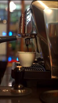 Espresso machine pouring coffee into a cup