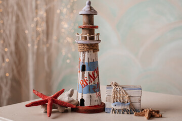 A beautifully crafted wooden lighthouse decoration, perfect for a coastal ambiance.