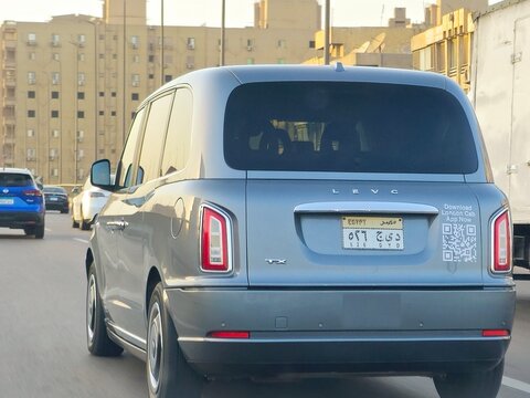 Giza, Egypt, April 2 2024: LEVC London Electric Vehicle Company Car, London Cab of Egypt, The LEVC TX, TX5, a purpose-built hackney carriage manufactured by the British commercial vehicle maker London