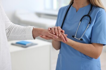 Professional doctor working with patient in hospital, closeup