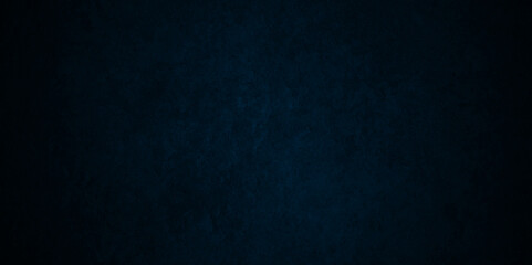 Dark blue stone wall blank backdrop light design. Dark blue or black slate background rock distress texture. High Resolution on dark black  and blue Cement Texture Background.
