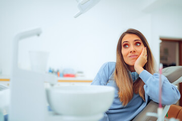 Concerned Patient Waiting for the Dentist Sitting in the Chair. Skeptical woman thinking about the...