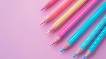 A set of six colored pencils in various colors arranged diagonally on a pink background.
