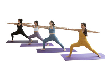 A group of women in yoga class doing the warrior pose