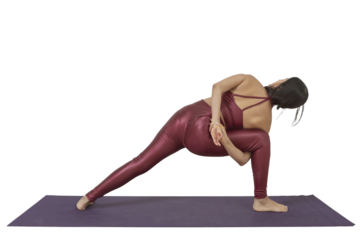 Young Mexican woman doing a yoga posture holding her hands behind her back. Not background