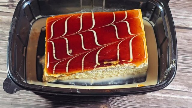 A tres leches cake, pan tres leches, a sponge cake soaked in three kinds of milk, evaporated, condensed and whole milk, covered with whipped cream and caramel sauce, light cake with air bubbles