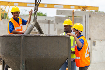 Foreman and worker team checking project at the precast factory site, Engineer man and builders in...