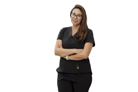 Portrait of a smiling dentist, standing in her dental surgery, with copy space.