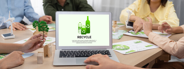 Recycle packaging displayed on laptop at a green business meeting while business team presenting...