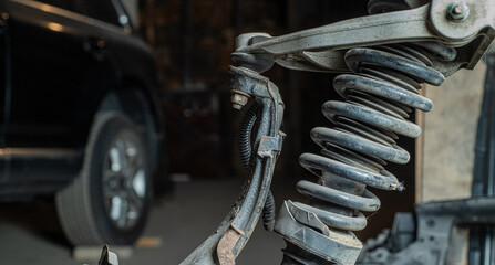 old car shock absorber with texture on a dark background