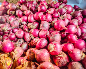 a pile of fresh shallots ready to be cooked