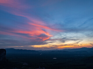 Fototapeta premium aerial view Beautiful pink cloud at sunset above mountain range in Phang Nga. .High peaks wonderful sunset natural Landscape. .Beautiful sunset tropical landscape background.