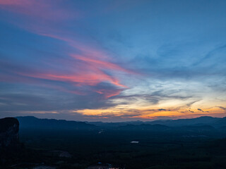 aerial view Beautiful pink cloud at sunset above mountain range in Phang Nga. .High peaks wonderful sunset natural Landscape. .Beautiful sunset tropical landscape background.