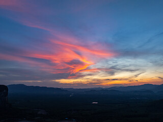 aerial view Beautiful pink cloud at sunset above mountain range in Phang Nga. .High peaks wonderful sunset natural Landscape. .Beautiful sunset tropical landscape background.