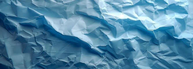 Fototapeta premium Light blue background with a crumpled paper texture
