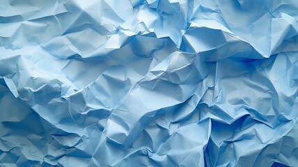 Obraz premium Light blue background with a crumpled paper texture