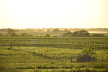 Sunset Over a Rural Farm Field