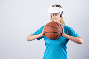 Girl wearing visual reality glasses and casual cloth and holding basketball. Caucasian woman...