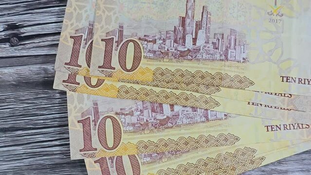 Saudi Arabia 10 SAR ten Saudi riyals cash money banknote with the photo of king Abdullah Bin AbdulAziz Al Saud, Murabba palace and King AbdulAziz Financial District in Al Aqeeq area of Riyadh