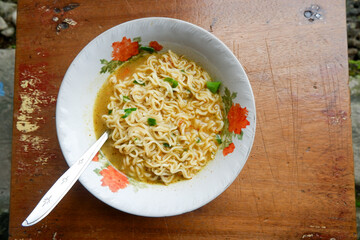simple noodle soup in a bowl. also called mie kuah