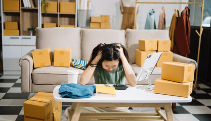 Asian owner woman prepare parcel box  woman is stressed, bored, and overthinking from working and...