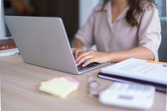 Young asian student in casual clothes watching tutorial and studying lecturer education online class while typing knowledge data and working homework with laptop digital technology in university