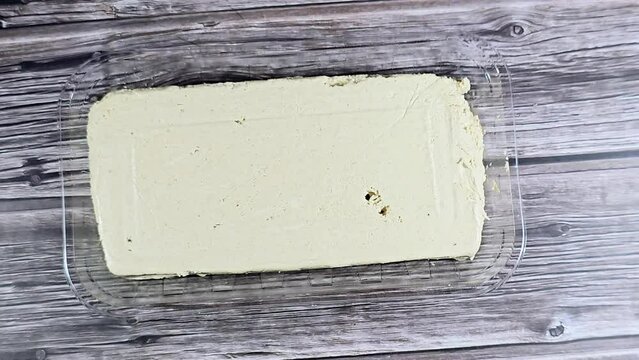Traditional plain tahini halva or Halawa Tahiniya, the primary ingredients in this confection are sesame butter or paste (tahini), and sugar, glucose or honey, it is basic tahini and sugar base