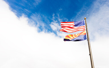 Design Waving American USA Flags and Flag of Arizona State on Flagpole On Background Of Blue White Sky, Template Horizontal Plane, Copy Space