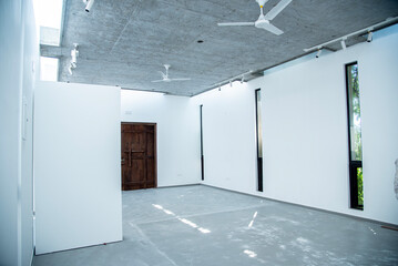 White background with light silhouette effect from the window,Exploration of light and space within modern architectural design, highlighting minimalistic aesthetics and functionality.