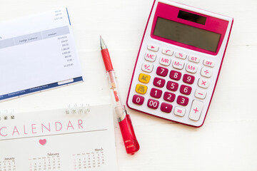 statement of credit card, calendar and calculator for check pay money arrangement flat lay style on...