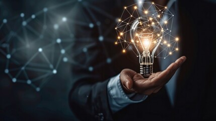 Businessman hand holding creative light bulb with industry network,analysis solution and development marketing network icons