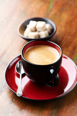 Cup of coffee on wooden background. Close up.	