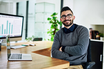 Obraz premium Laptop, crossed arms and portrait of business man in office with company pride, confidence and smile. Startup, professional agency and person on computer for career, work and job in digital marketing