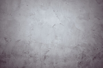 A grey wall with a grey background. The wall is covered in a grey paint and has a rough texture