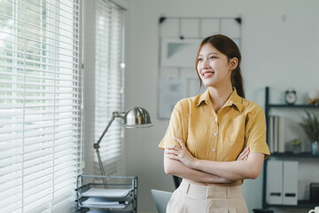 Attractive charming asian woman arms crossed self-confident person worker friendly smile good mood...